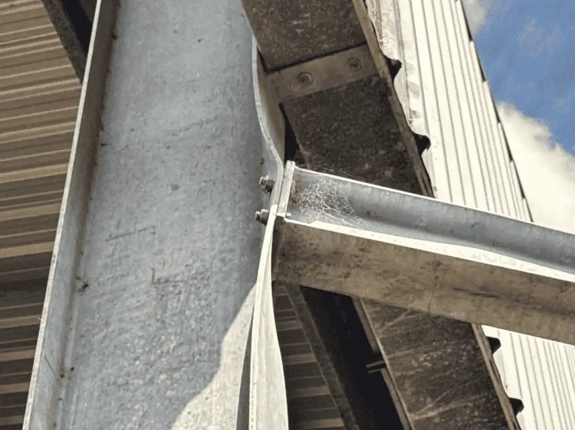 Roof edge and gutter junction viewed from below.